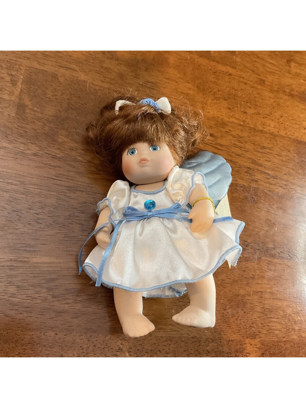 Classic Creations Porcelain Birthstone Angel doll with Light Blue Wings